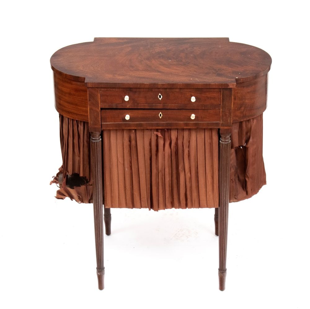 Mahogany side table - England,19th century: Mahogany side table - England,19th centuryHeight x width x depth: 73 x 66 x 36 cm with two front drawers and a compartment below for storing knitting needles and sewing supplies. William IV period.Ite
