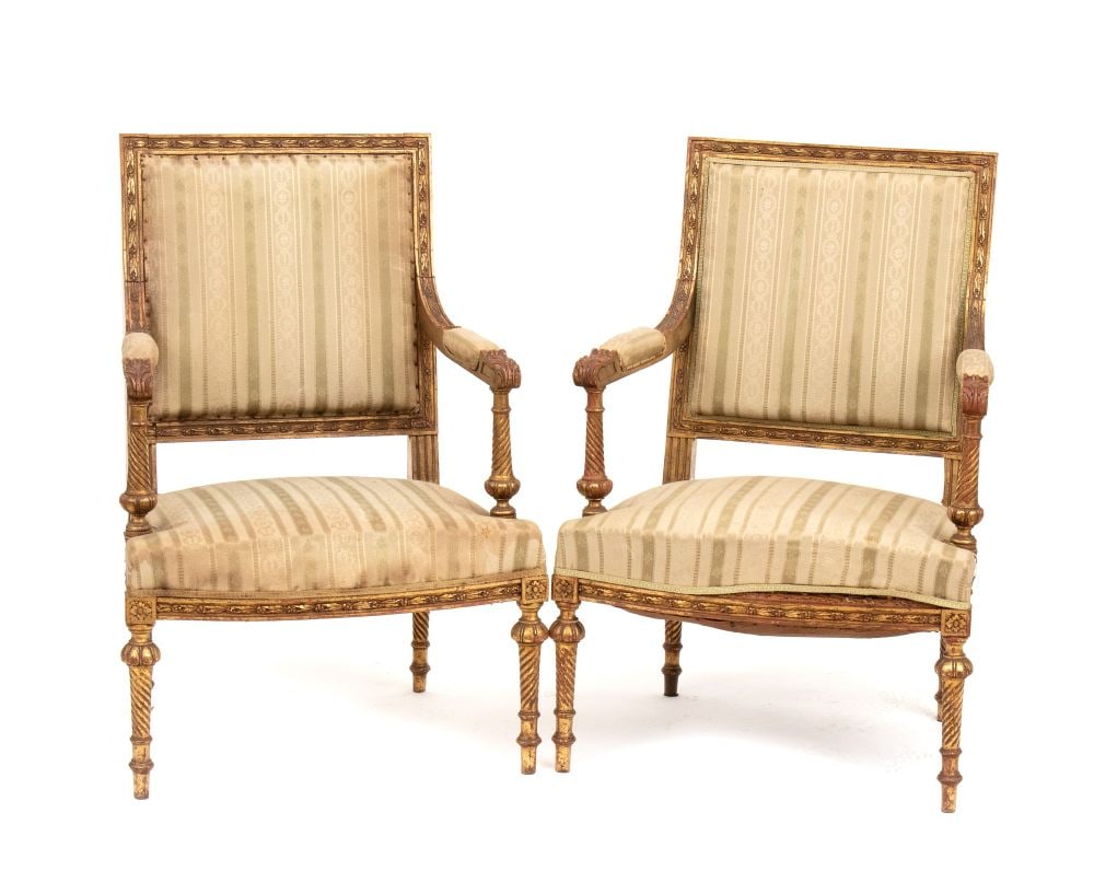 A pair of French gilt armchairs, Louis XVI style - First half of the 19th century: A pair of French gilt armchairs, Louis XVI style - First half of the 19th centuryHeight x width x depth: 89 x 60 x 56 cm. Seat height: 40 cm.finely carved and small in size.Item condition grading: ***