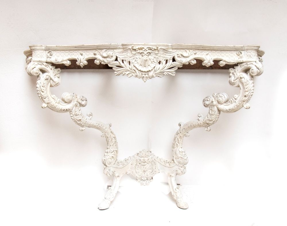 Carved and lacquered wall console - France, 19th century: Carved and lacquered wall console - France, 19th centuryHeight x width x depth: 105 x 160 x 60 cm.carved with rocaille motifs, leafy scrolls, shells, and masks. Shaped legs joined by a carved crossbar