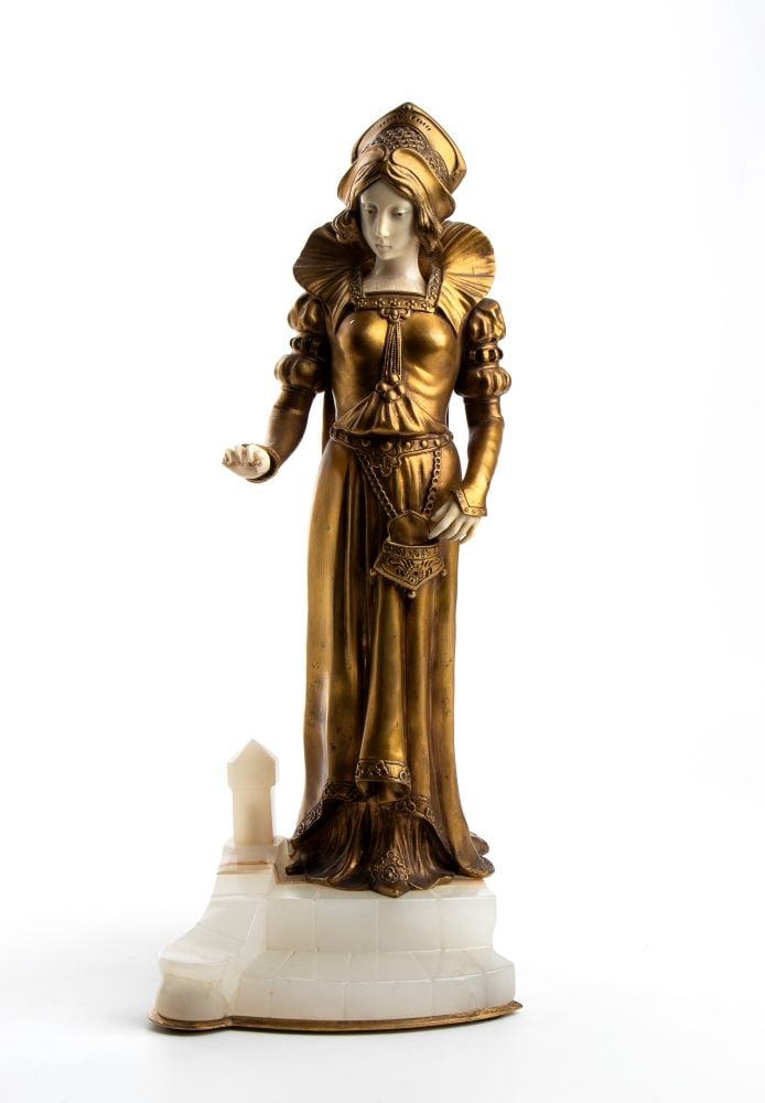 ETIENNE WATRIN (1890 - 1915) Finely dressed standing Elizabethan maiden, bronze and ivory: ETIENNE WATRIN(1890 - 1915) Finely dressed standing Elizabethan maiden, bronze and ivoryHeight x width x depth: 35.5 x 14 x 14 cm. Weight: 3700 g.circa 1900depicting a female figure dressed in