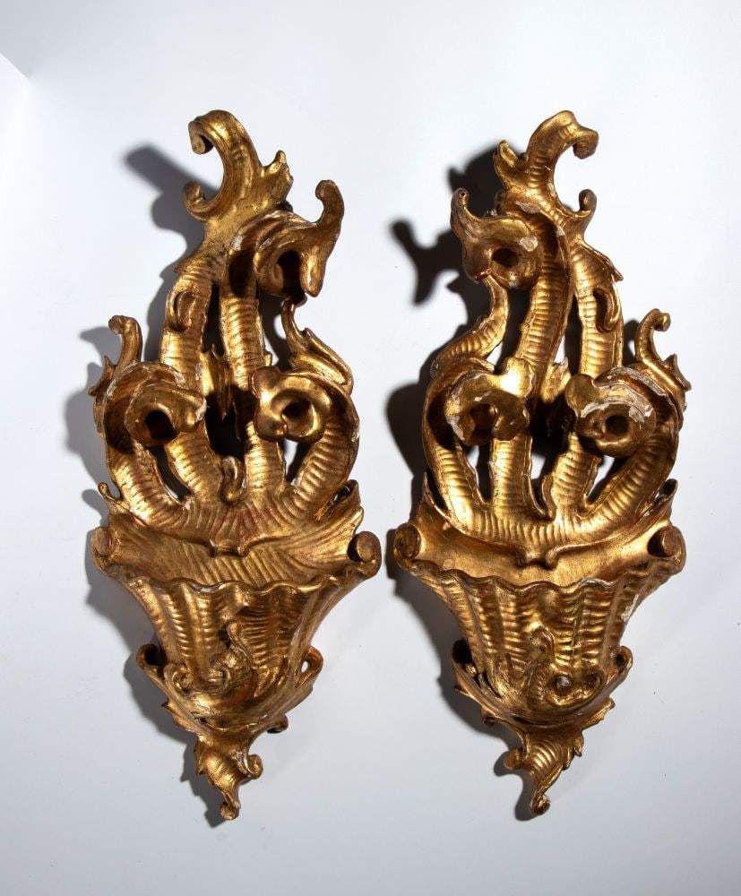 Pair of Louis XVI-style gilded wooden wall-mounted holy water fonts: Pair of Louis XVI-style gilded wooden wall-mounted holy water fontsHeight x width x depth: 37 x 16 x 5 cmVeneto-Lombardy region, 18th centuryfinely carved, featuring rich scrollwork and rocaille