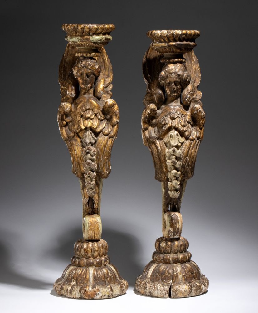 Pair of gilded wooden candlesticks: Pair of gilded wooden candlesticksHeight x diameter: 61 x 17 cm 17th–18th centuriesshaped like a winged caryatid, each consisting of a female bust emerging from a stylized body with a plant-like