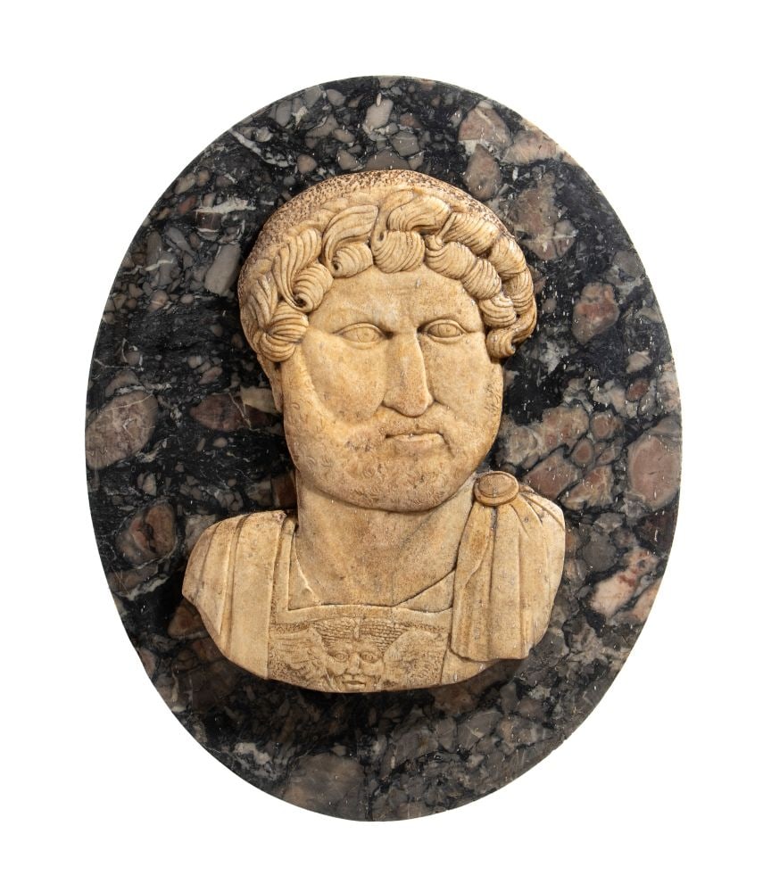 Marble bas-relief depicting Emperor Hadrian: Marble bas-relief depicting Emperor HadrianHeight x width: 56 x 43 cmItaly, 20th centuryon an oval base of dark, veined marble to highlight the figure's face, which is carved from light-colored