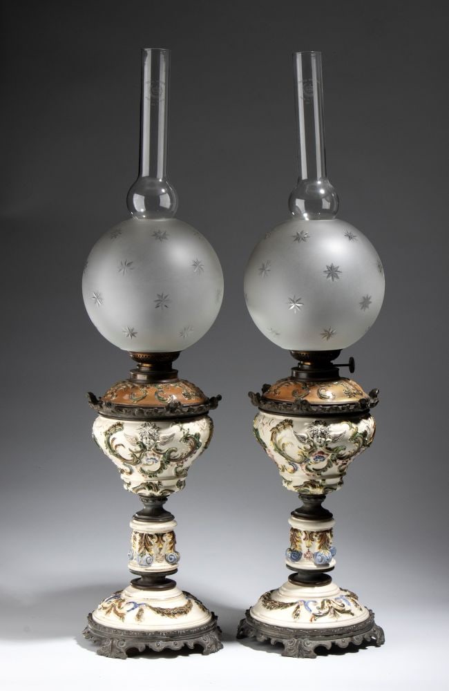 Pair of Large Kerosene Lamps: Pair of Large Kerosene Lamps Height x diameter: 84 x 20 cm France, late 19th centurymade of high-fired enameled sheet metal, finely decorated in relief in the Neo-Renaissance style, and painted in