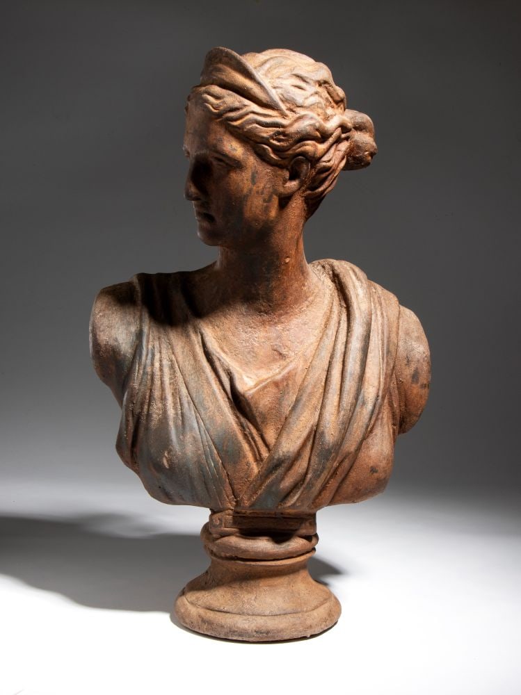 Iron bust of Diana: Iron bust of DianaHeight x width x depth: 51 x 30 x 21 cmLate 19th century–early 20th centuryon a circular pedestal integrated into the casting.This lot is currently in storage with the