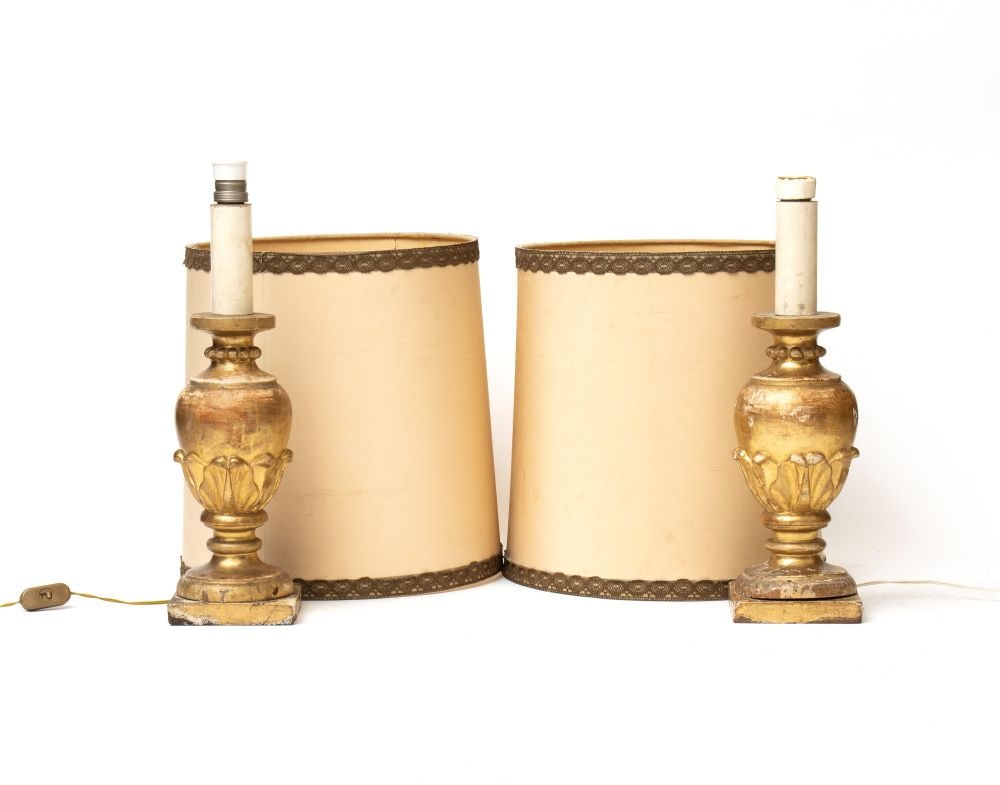 Pair of gilded wooden lamps: Pair of gilded wooden lampsHeight x width x depth: 46 x 13 x 13 cmCentral Italy, 19th centuryfinely carved with plant motifs on the base.Item condition grading: **** good.The lot is in a good state