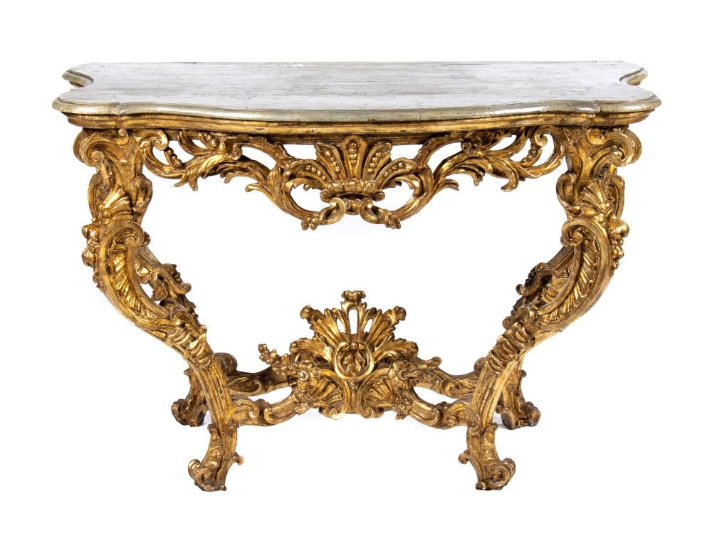 Italian Louis XV gilded console table - Piedmont, 18th Century: Height x width x depth: 85 x 128 x 70 cmcarved and sculpted wood with floral and geometric motifs, gilded with gold leaf with gray painted wood top.Item condition grading: **** good.The lot is in a go