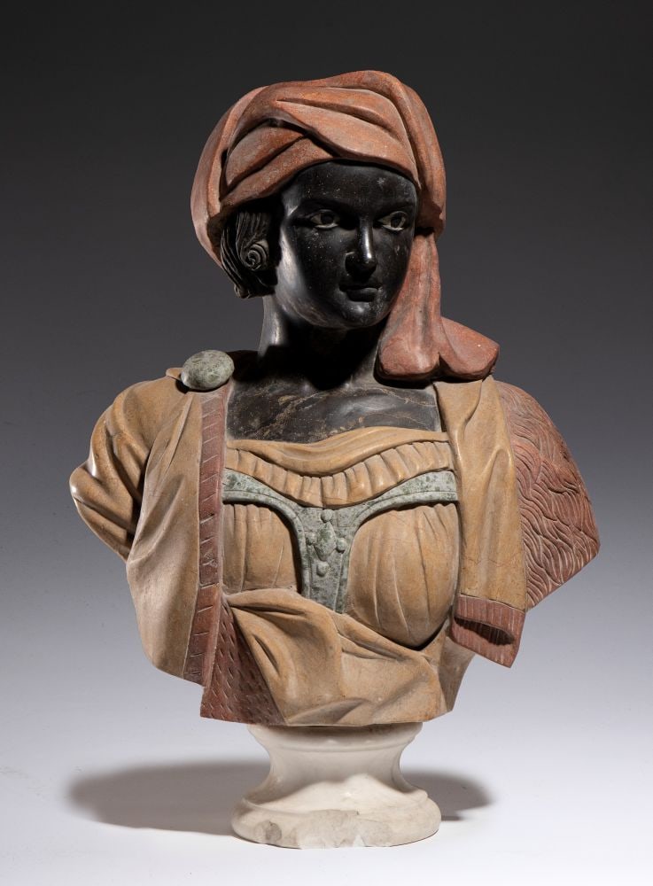 Bust of “Moretta” in polychrome marble - Italy, late 19th century: Height x width x depth: 66 x 46 x 22 cma sculpture depicting a young African figure wearing a lavish turban, carved from red stone. The robe is made of yellow marble, while the face and neck are carve