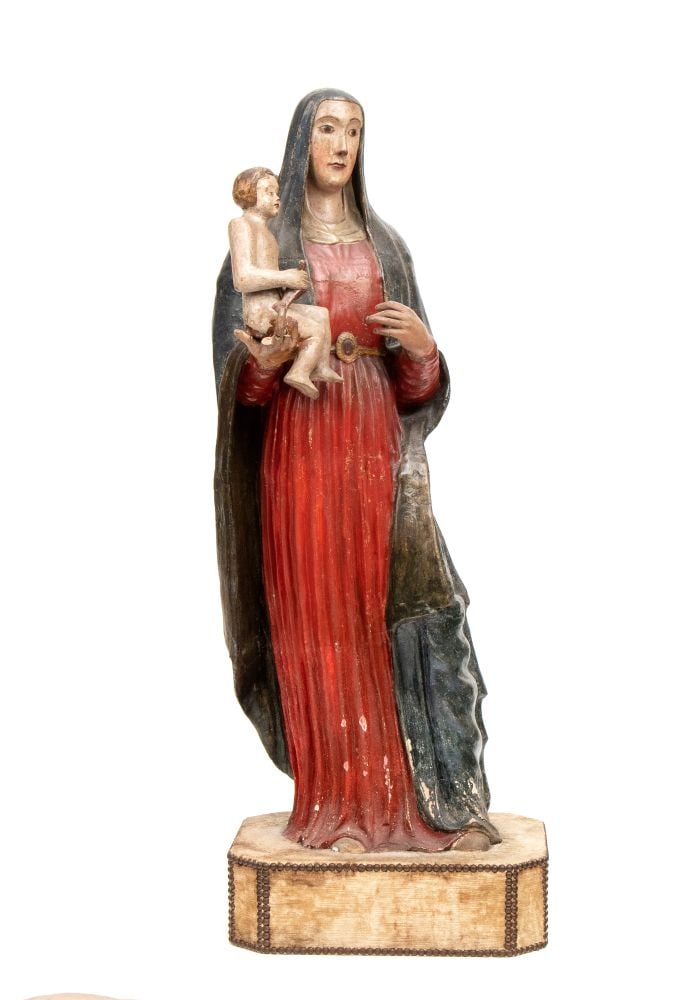 Polychrome terracotta sculpture - Southern Europe, 19th century: Height x width x depth: 120 x 45 x 33 cm.depicting the Virgin Mary in a standing pose, holding the Baby Jesus on her right side. The sculpture rests on a decorated octagonal plinth. The Madonna is wra