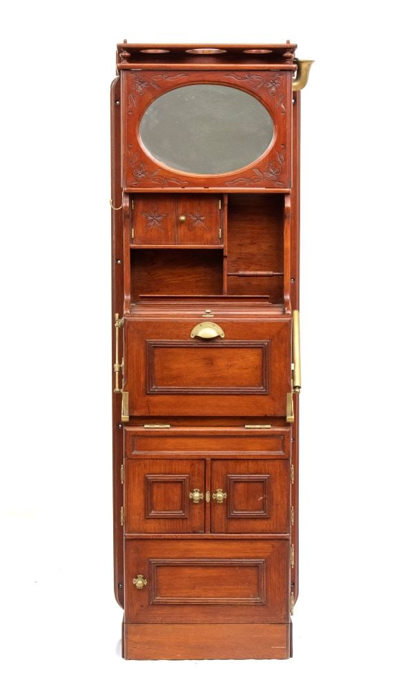 Ship bathroom cabinet Liberty style - Late 19th century: Height x width x depth: 118 x 58 x 27 cm.in mahogany with brass finishes, characterized by a space-saving modular structure with vertical development. Upper part with removable and tilting oval mirror