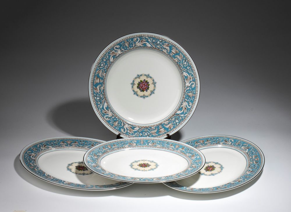 “Florentine Turquoise” porcelain dinner service by Wedgwood - England, 20th century: model W2714, white bone china, consisting of 70 pieces. Decorated with turquoise enamel featuring motifs of dragons, griffins, and vases in the Renaissance style. The manufacturer’s marks are st