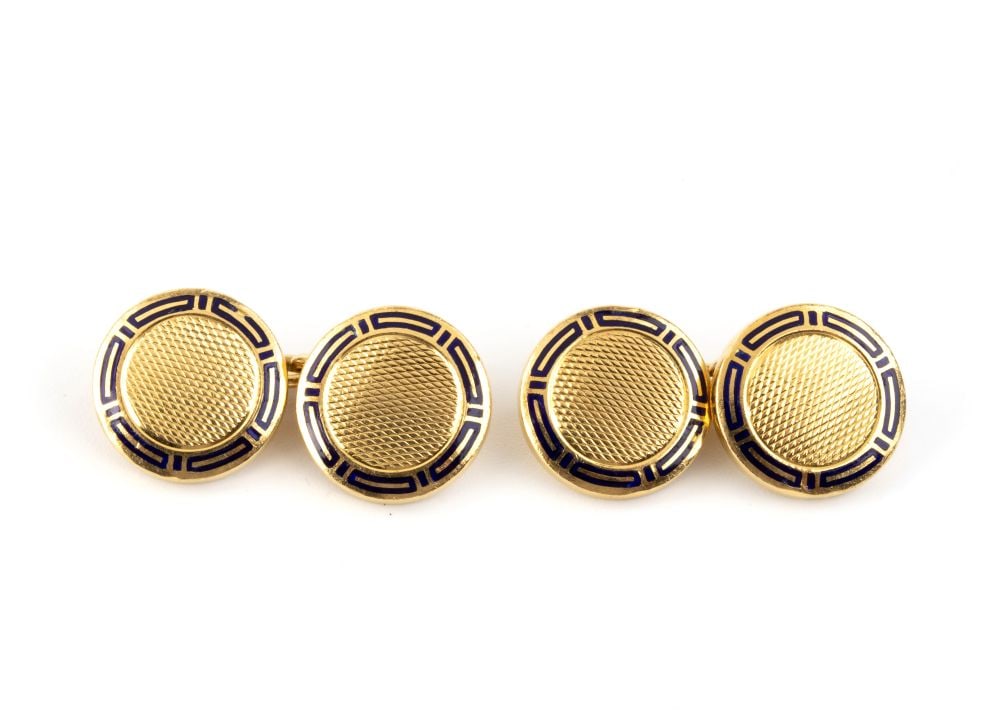 BULGARI Gold enamel pair of cufflinks: Round shaped 18k yellow gold, featuring iconic blue enamel decorations.Hallmarked “750”. Signed "BVLGARI".Diameter: 1.2 cm. Weight: 15.4 g.