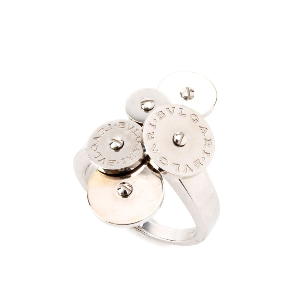BULGARI Cicladi Collection: gold ring: 18k white gold, comprising five discs that extend along the frame. The movable plates, two of which are engraved with the words "Bulgari Bvlgari’" are inlaid with small studs, creating a contras