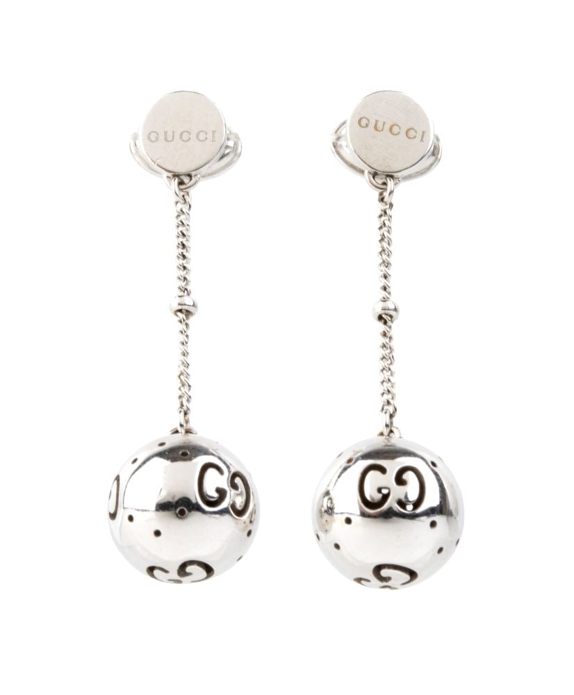 GUCCI Gold drop pair of earrings: 18k white gold, each with a dotted and openwork ball pendant.Hallmarked “Au 750”. Signed "GUCCI". Length: 3.5 cm. Weight: 5.8 g.