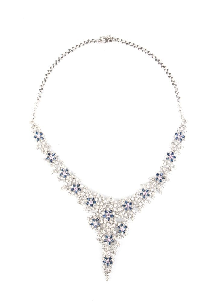 Sapphire diamond gold necklace: 18k white gold, with a central section featuring floral motifs set with blue sapphires, pink sapphires and brilliant-cut diamonds with an estimated total weight of approx. 30.00 ct.Hallmarked