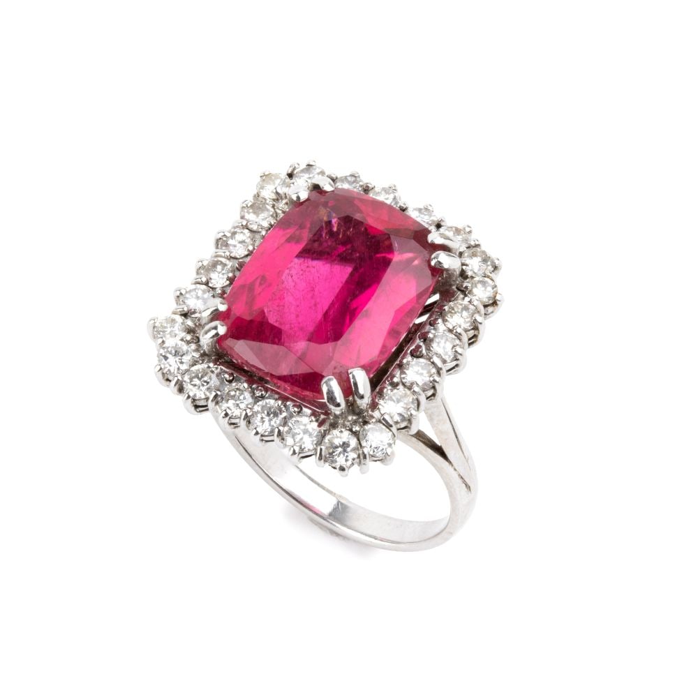 Tourmaline diamond gold ring: White gold, set with a rubellite tourmaline framed by 24 brilliant-cut diamonds with an estimated total weight of approx. 1.20 ct, colour G-H, clarity VS, as gauged and graded in the mount.IT size 17