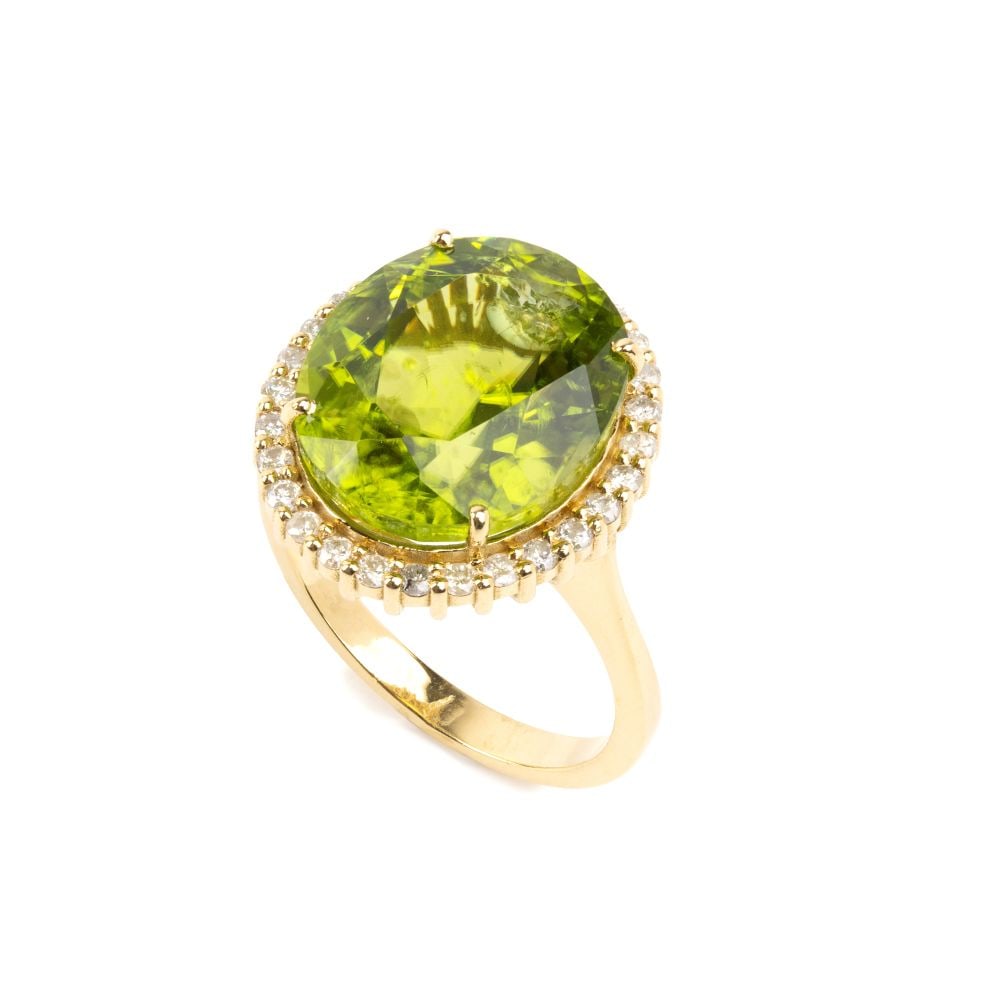 Peridot diamond gold ring: 18k yellow gold, set with an oval-shaped peridot, estimated to weigh approx. 10.78 ct, and round brilliant-cut diamonds, estimated to have a total weight of approx. 0.43 ct, colour I-J, clarity I, as