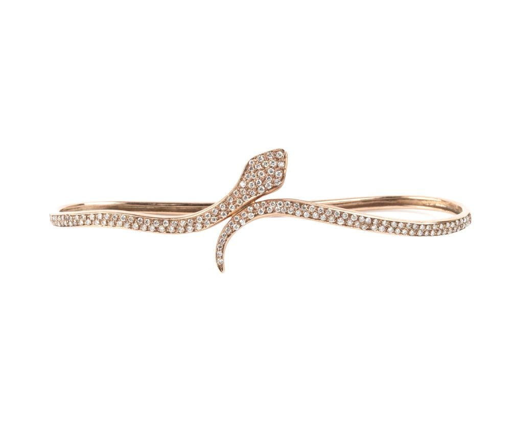 Diamond gold snake bracelet: 8k rose gold, with a pavé set brilliant-cut diamonds estimated total weight of approx. 1.60 ct, colour I–J, clarity SI.Hallmarked "750". Signed "MARTA PAOLILLO".Weight: 8.5 g.