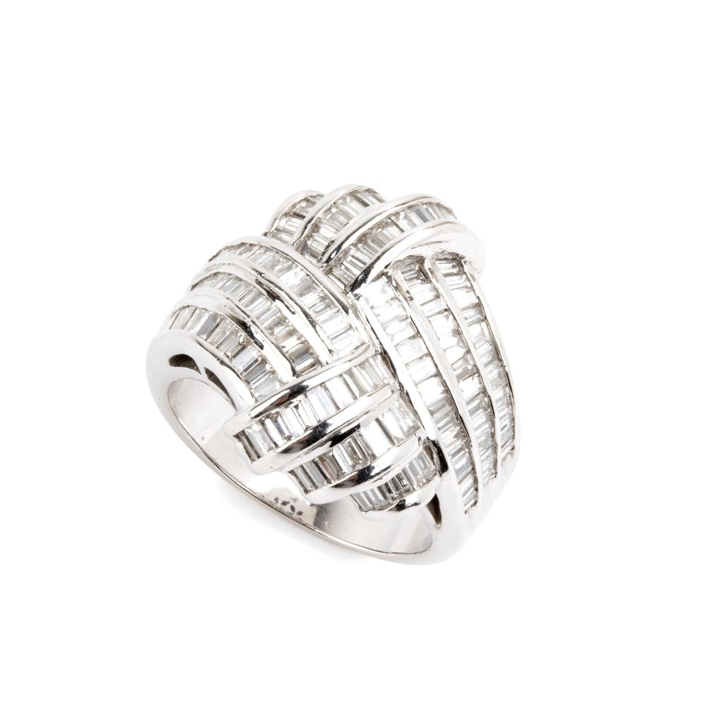 Diamond gold band ring: 18k white gold, featuring an interlaced ribbon motif set with baguette and tapered-cut diamonds, estimated total weight of approx. 2.60 ct, colour F-G, clarity VS-SI, as gauged and graded in the