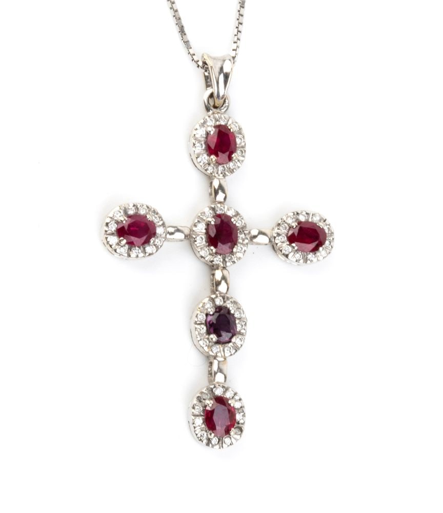 Ruby diamond gold necklace-pendant: 18k white gold, with a fine Venetian-link chain whith a cross-shaped pendant set with oval-shaped rubies, estimated to weigh approx. 1.80 ct, surrounded by brilliant-cut diamonds estimated to weigh a