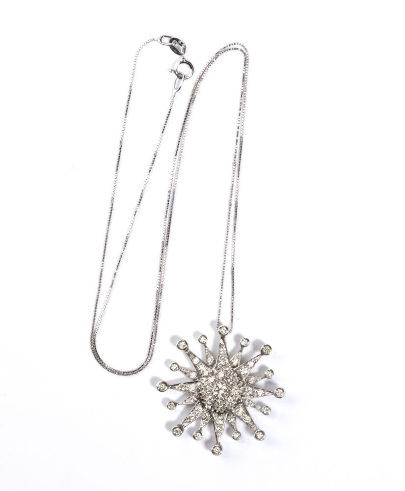 Necklace with a gold diamond pendant: 18k white gold, with thin chain from which hangs a pendant featuring the stylised silhouette of a sun, with pave set round brilliant-cut diamonds, estimated to weigh a total of approx. 1.00 ct, H