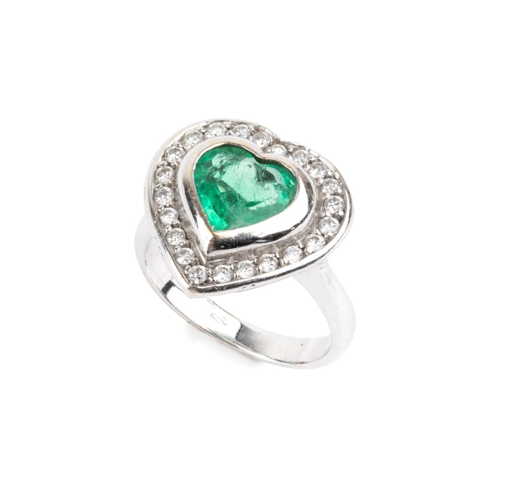 Heart shaped emerald diamond gold ring: 18k white gold, set with a heart-shaped emerald estimated to weigh approx. 2.00 ct, framed by 22 brilliant-cut diamonds estimated total weight of approx. 0.22 ct, colour G-H, clarity VS, as gauged and