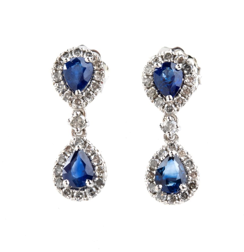 Blue sapphire diamond gold pair of drop earrings: 18k white gold, each with a couple of pear-shaped sapphire framed by diamonds. N. 48 round brilliant-cut diamonds, estimated to weigh a total of approx. 0.50 ct, H colour and n. 04 sapphires, pear