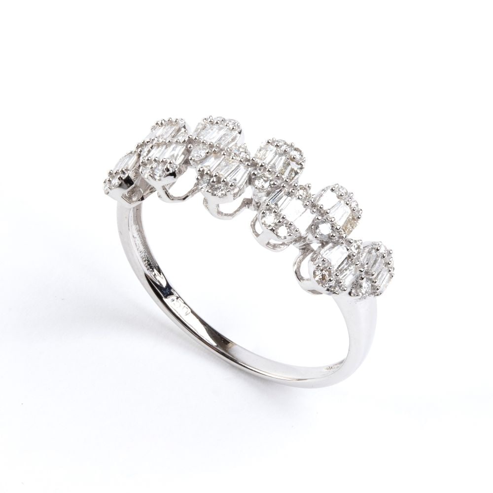 Diamond gold ring: 18k white gold, featuring a wave motif set with brilliant-cut and baguette-cut diamonds estimated to weigh a total of approx. 0.80 ct, color F-G, clarity VS-SI, as gauged and graded in the