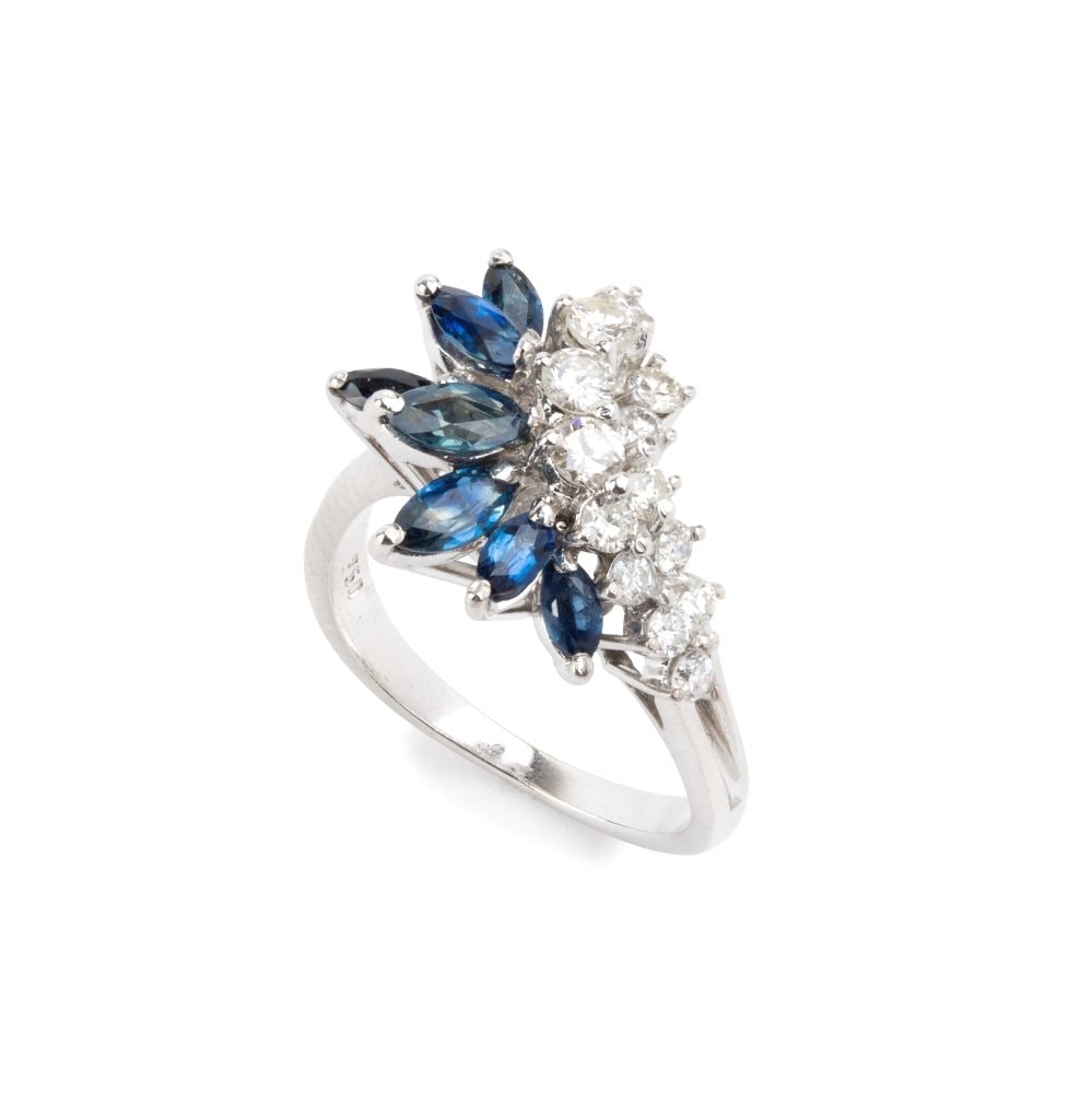 Blue sapphire diamond gold ring: 18k white gold, set with navette shaped sapphires with an estimated total weight of approx. 1.00 ct and n. 13 brilliant-cut diamonds with an estimated total weight of approx. 0.70 ct, colour G-H, clar