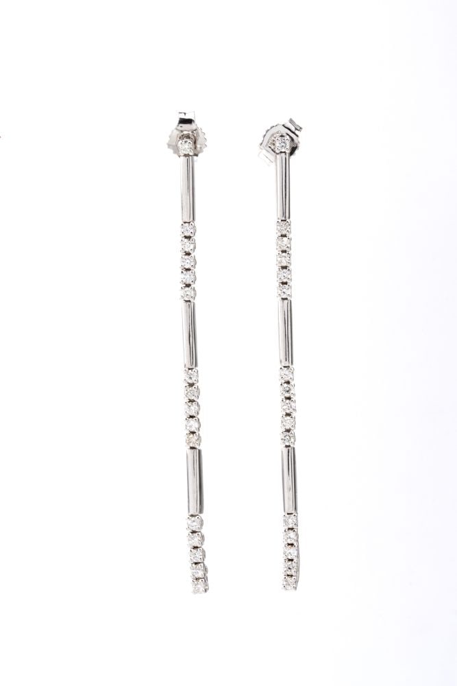 Pair of diamond stud earrings: 18k white gold, set with round brilliant-cut diamonds, estimated to weigh a total of approx. 0.53 ct, G-H colour, VVS-VS clarity, as gauged and graded in the mount.Hallmarked “750”.