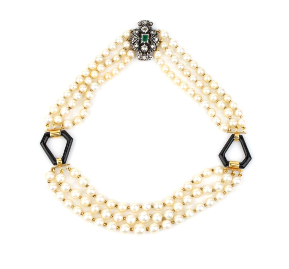 Emerald diamond cultured pearl necklace: Three strands of saltwater cultured pearls, interspersed with yellow gold geometric elements with black enamel; silver and yellow gold floral clasp, set with an emerald and rose-cut diamonds. Pearls