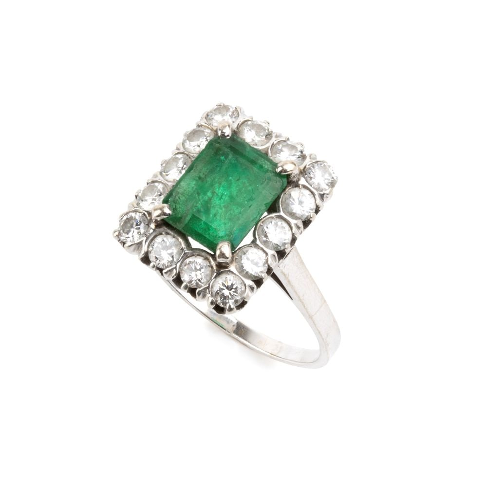 Emerald diamond godl ring: 18k white gold, set with an emerald-cut emerald estimated to weigh approx. 1.40 ct, framed by brilliant-cut diamonds estimated total weight of approx. 1.00 ct, colour F-G, clarity VVS.Hallmarked
