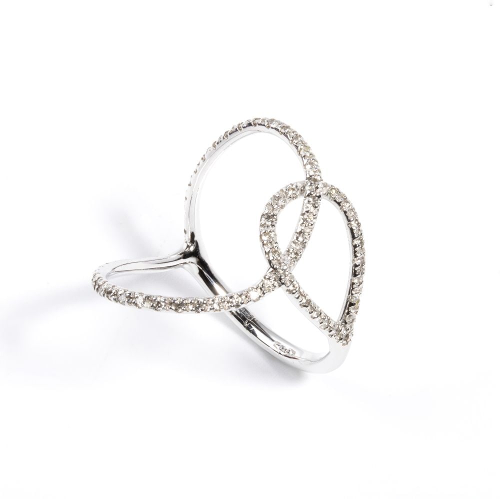 Gold and diamond ring: 18k white gold ring, featuring ribbons patterns set with round brilliant cut diamonds estimated total weight approx. 0.35 ct, colour H-I, VS-SI, as measured with the setting.Hallmarked