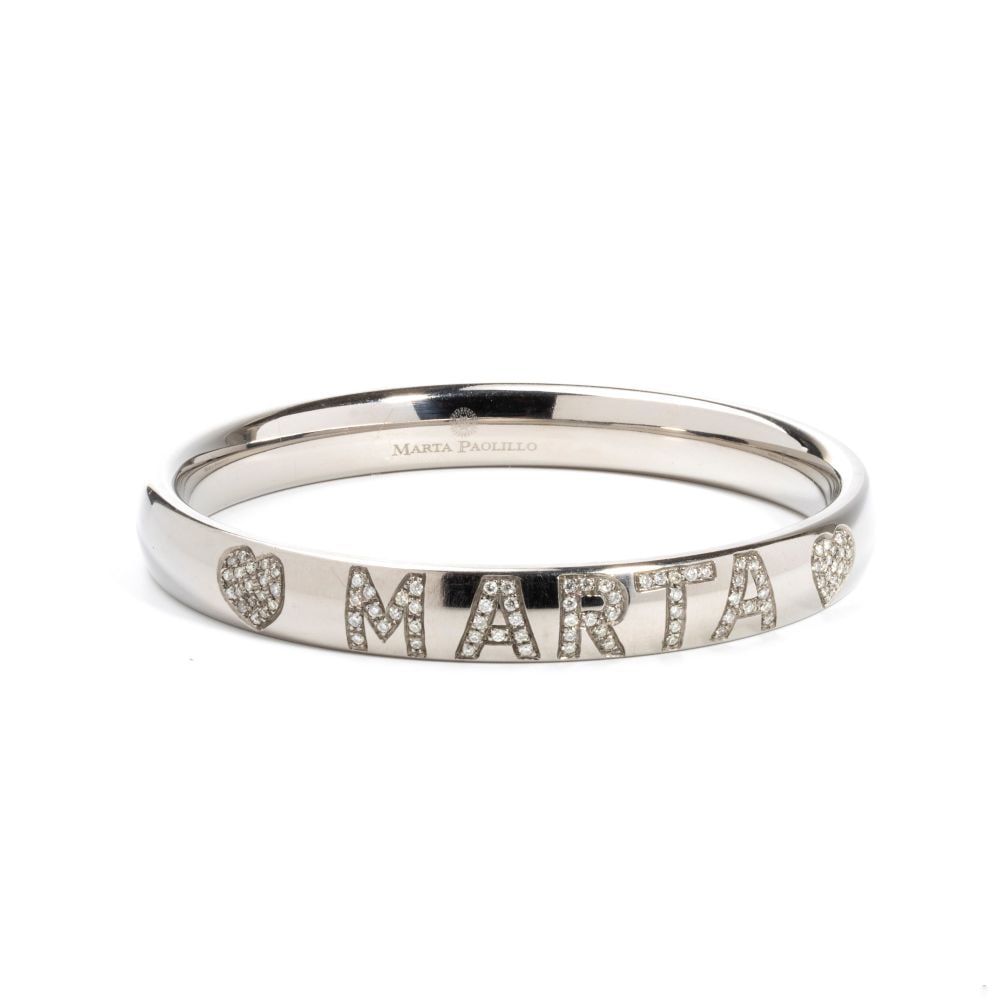 Diamond titanium rigid bracelet: inscribed with the name "MARTA" in round brilliant-cut diamonds, estimated total weight approx. 1.00 ct, colour H-I, clarity VS-SI, as measured and graded in the setting. Signed MARTA PAOLILLO.Inner