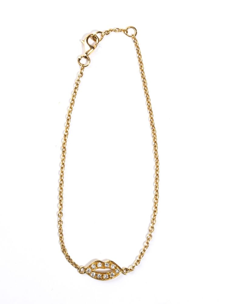Diamond gold bracelet: 18k white gold, featuring the stylised silhouette of a mouth, embellished with pavé set round brilliant-cut diamonds, estimated to weigh a total of approx. 0.14 ct, colour H, clarity VS, as