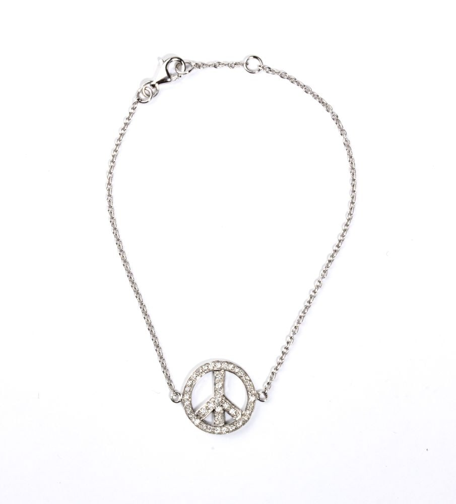 Gold diamond bracelet: 18k white gold, featuring a link chain bracelet with a pendant depicting the peace symbol (CND) set with pavé set diamonds estimated to weight a total of approx. 0.24 ct, F-G colour, VVS-VS