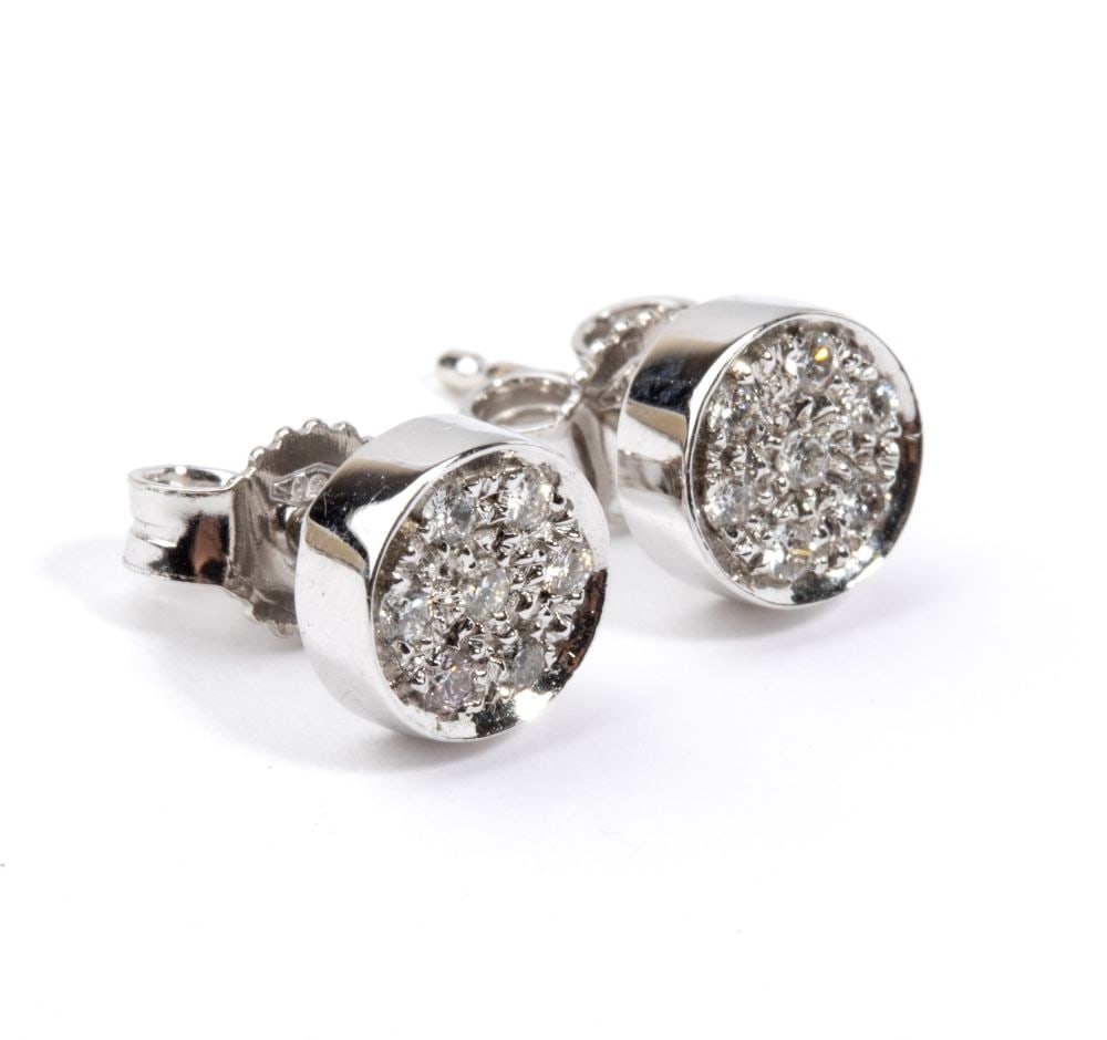 A pair of geometric gold and diamond earrings: 18k white gold, round shaped, with pave set round brilliant-cut diamonds, estimated to weigh a total of approx. 0.15 ct, G-H colour, VS clarity, as gauged and graded in the mount.Hallmarked