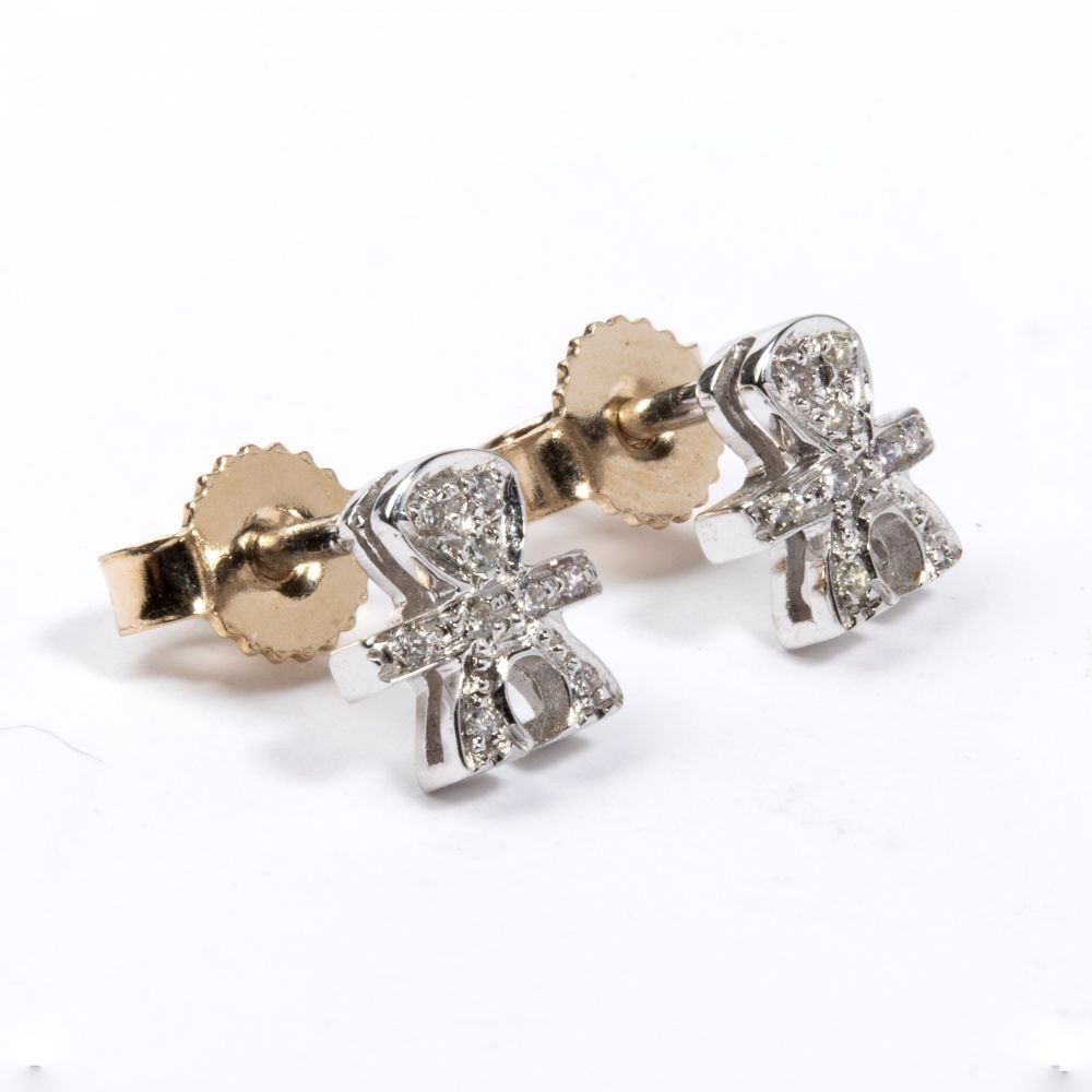 Diamond gold earrings: 18k white gold, featuring the stylised silhouette of a little boy, embellished with a pavé setting of round brilliant-cut diamonds, estimated to weigh a total of approx. 0.05 ct, colour H,