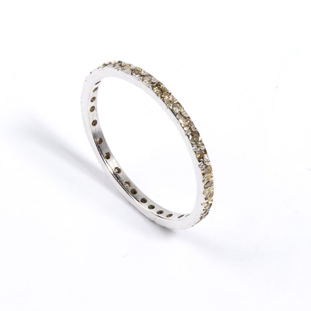 Fancy color brown diamond gold ring: 18k white gold, set with brown fancy color diamonds estimated total weight approx. 0.28 ct, as measured and graded in the setting.IT size 10 – US size 5 ½. Weight: 0.8 g