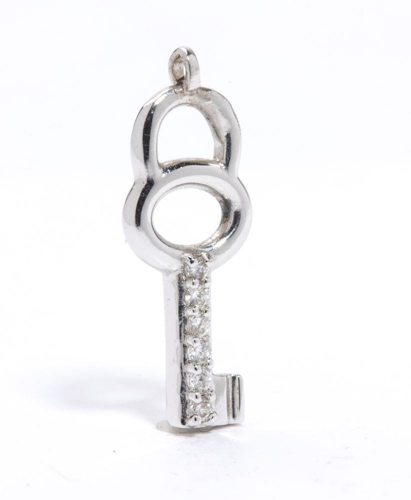 Diamond gold pendant: 18k white gold, featuring the silhouette of a key, embellished with a pavé setting round brilliant-cut diamonds, estimated to weigh a total of approx. 0.07 ct, colour G, clarity VS-SI, as