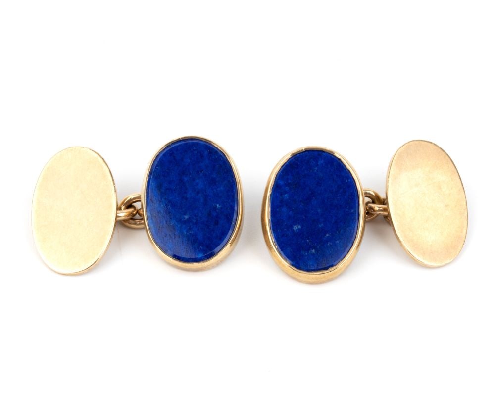 A pair of gold and lapis lazuli cufflinks: Oval shape, 9k yellow gold, set with a lapis insert. Front dimensions: 2 x 1 cm. Weight: 11.5 g.