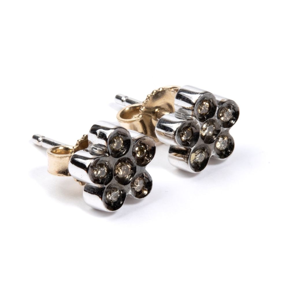 Fancy color brown diamond gold pair of earrings: 18k white gold ruthenium plated, set with fancy color brown round brilliant cut diamonds estimated to weigh a total of approx. 0.10 ct.Hallmarked “750”. Front dimensions: 0.6 x 0.6 cm.