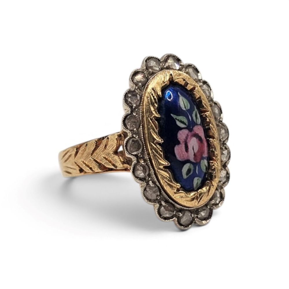 Diamond enamel miniature gold ring: 18k white and yellow gold, featuring an enamel floral miniature framed by rose-cut diamonds.Hallmarked "750 – 230 AL".IT size 14 – US size 7. Weight: 8.9 g.