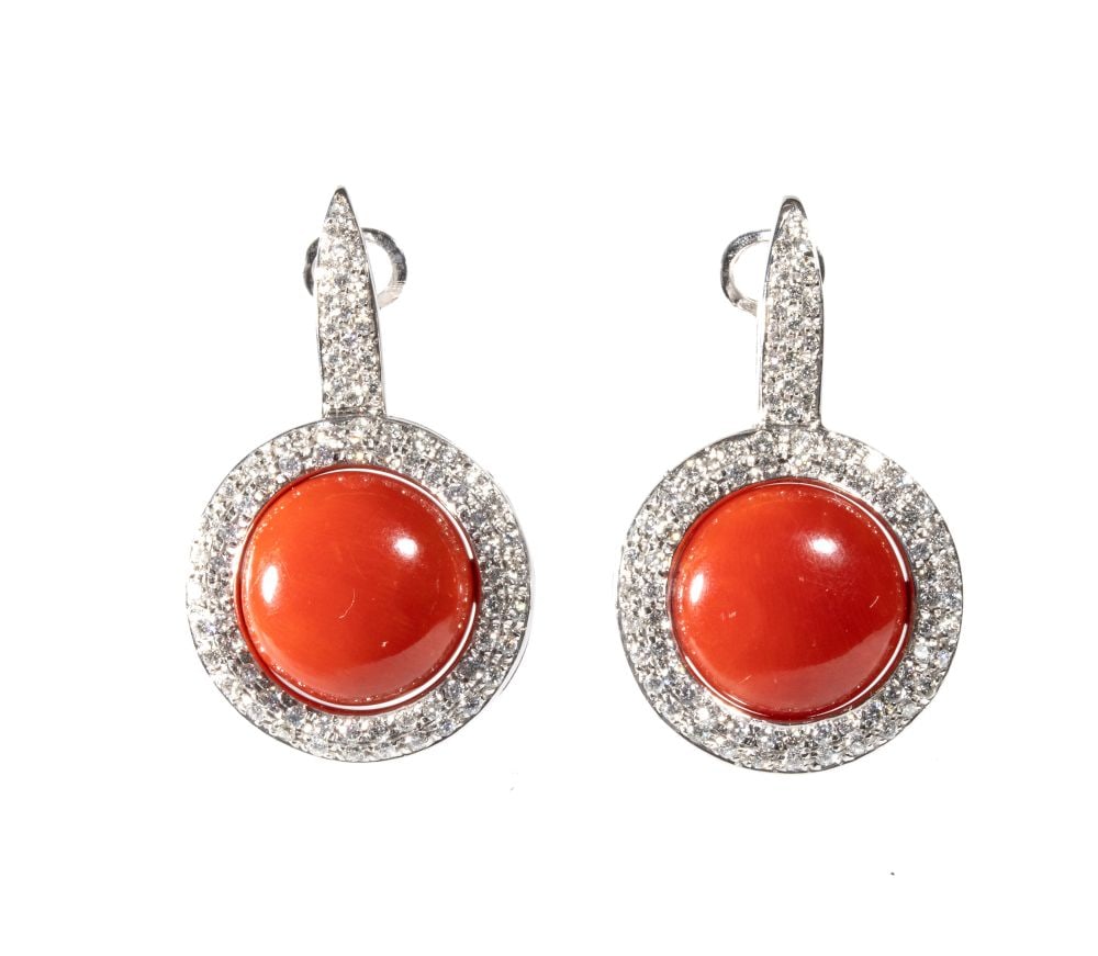 Aka coral diamond pair of gold earringgs: 18k white gold, set with cabochon-cut Aka coral (Corallium japonicum) surrounded by a pavé set brilliant-cut diamonds total weight of approx. 1.50 ct, colour F-G, clarity VVS.Hallmarked “75