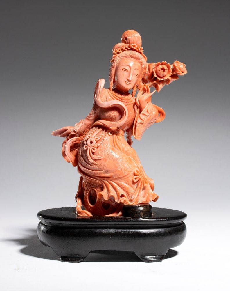 Chinese Cersuolo coral carving: Carved from a single piece of "Cerasuolo" coral (Corallium elatius), the sculpture depicts Guanyin, the Bodhisattva of Compassion and Mercy, portrayed in a graceful, flowing pose that follows the natu