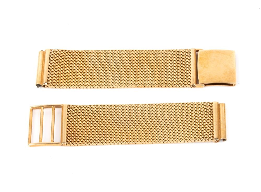 Gold watch bracelet: Semi-rigid mesh.Hallmarked "750". Weight: 48 g.Width: 20 mm. Maximum length: 16.5 cm. Weight: 48 g.