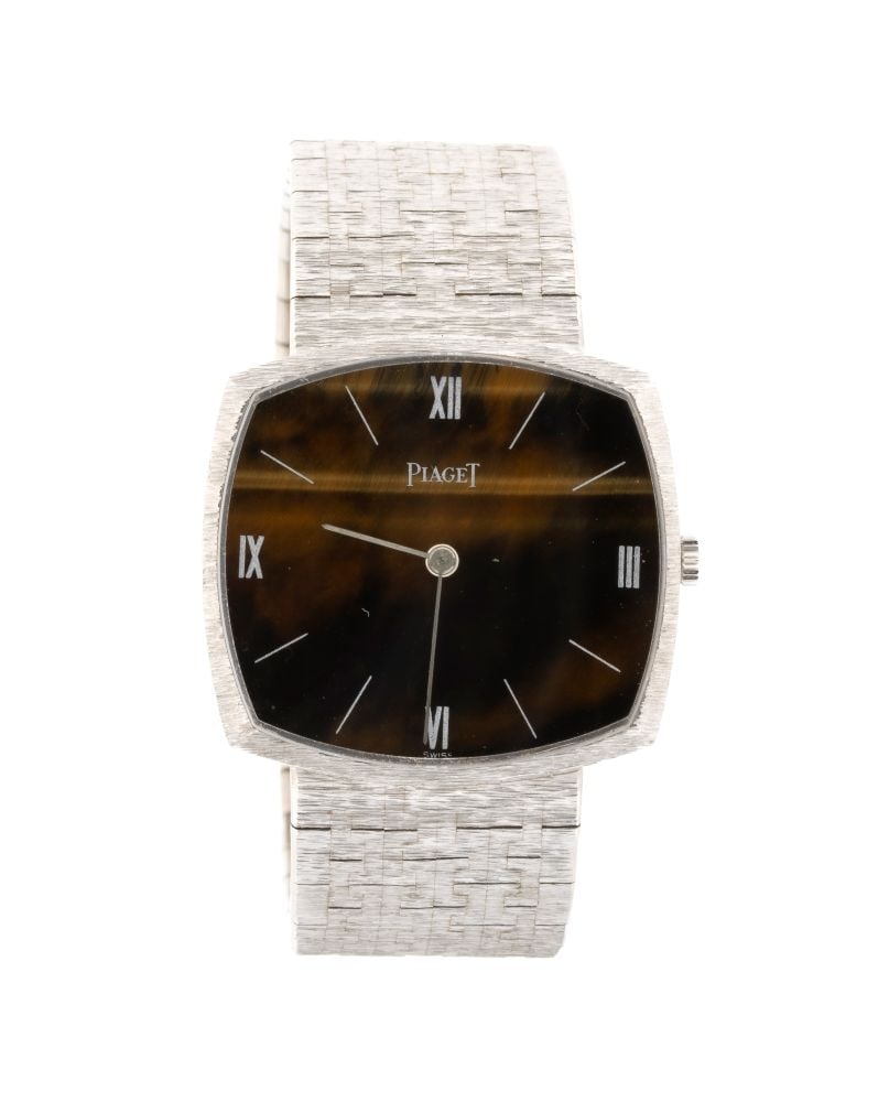 PIAGET Wristwatch: With a tiger's-eye dial and “JEAN ETE PARIS” engraving.Reference 9501 AG, serial number 152447.Dial dimensions: 28 x 30 cm. Gross weight: 73 gr.