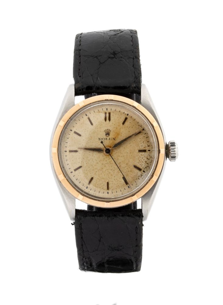 ROLEX Oyster Perpetual: wristwatch: With a steel and gold case. Armored movement.Reference 6085, serial number 778149.Case diameter: 32 mm.