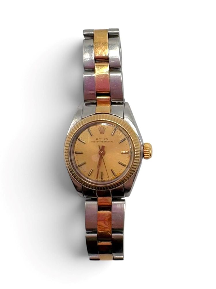 ROLEX Oyster Perpetual Lady wristwatch, ref. 6719: Case and bracelet in steel and gold, champagne-coloured dial with baton hour-markers, plastic crystal, self-winding mechanical movement, serial number 7,234,662, dating from 1982.Diameter 22 mm.