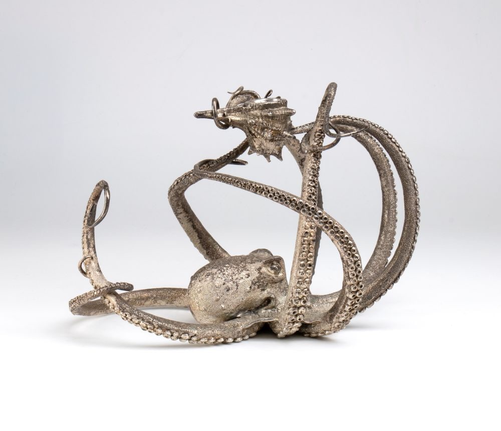 FORLENZA Italian sterling silver candlestick: depicting an octopus modelled with extraordinary realism and dynamism. The body rests on the base, whilst the long tentacles wind and curve through the space, creating a three-dimensional interplay of